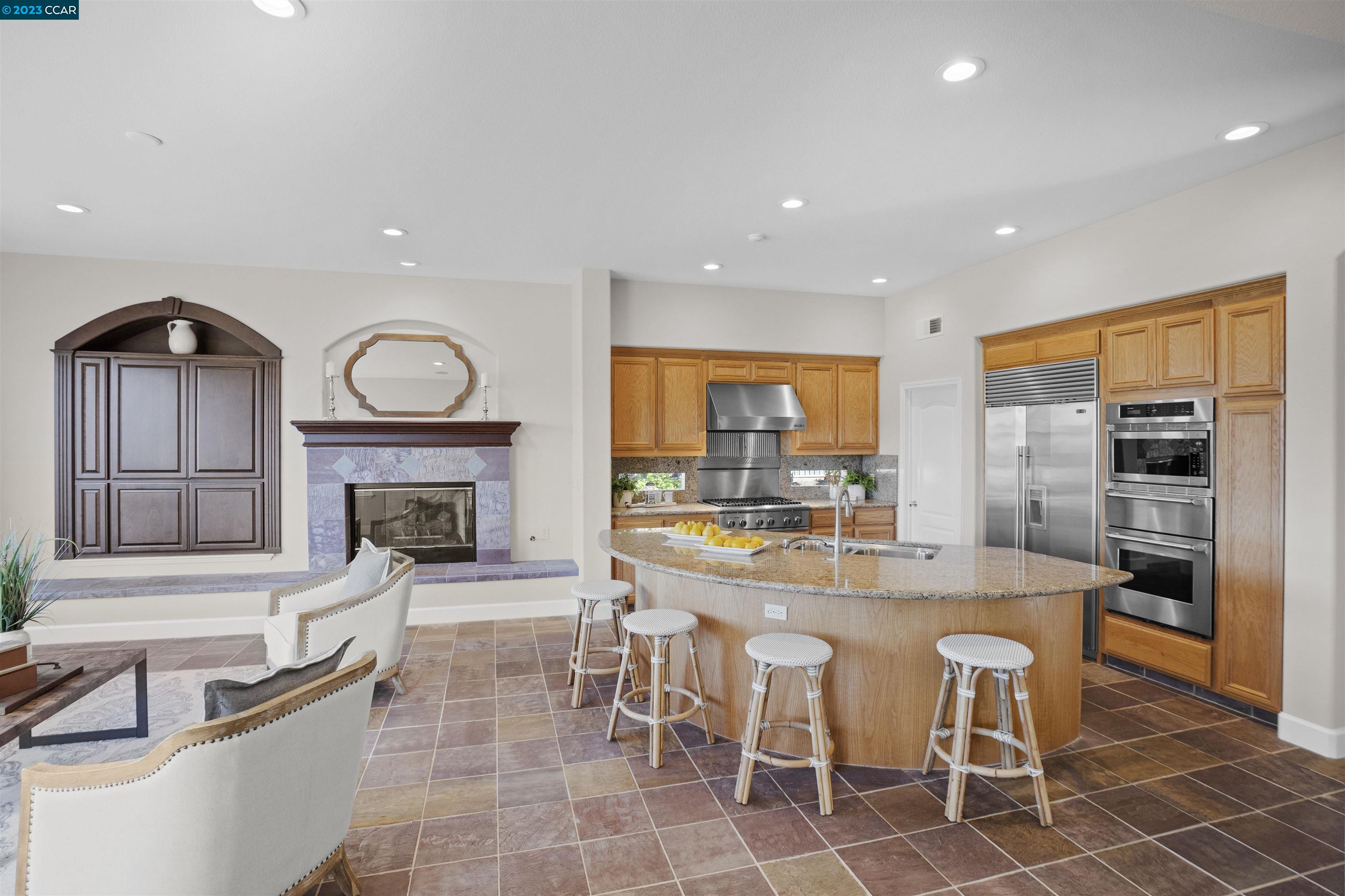 9548 Velvetleaf Circle San Ramon, CA 94582 - Photo 3 of 8 a large kitchen with a table and chairs