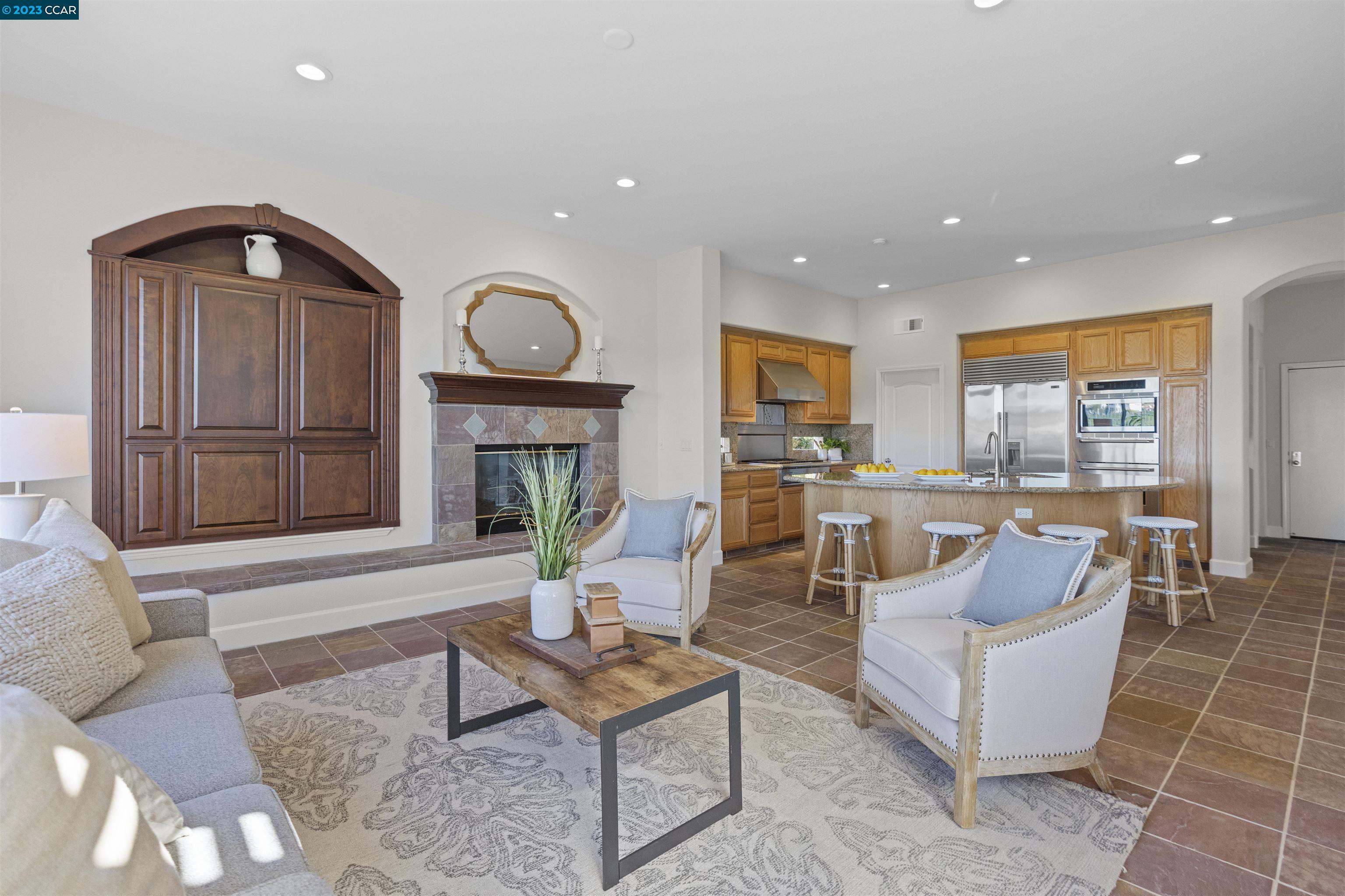 9548 Velvetleaf Circle San Ramon, CA 94582 - Photo 5 of 8 a living room with fireplace furniture and a large window
