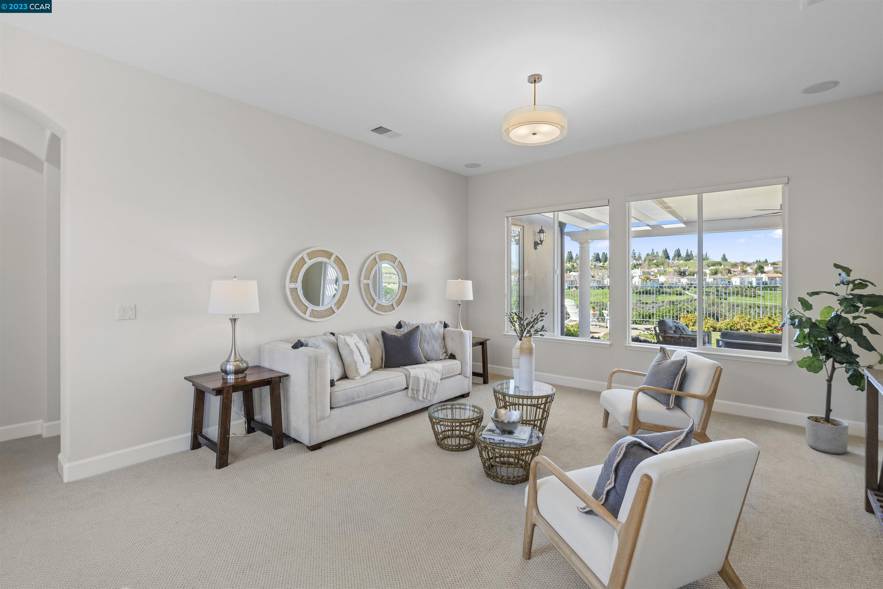 9548 Velvetleaf Circle San Ramon, CA 94582 - Photo 6 of 8 a living room with furniture and a large window