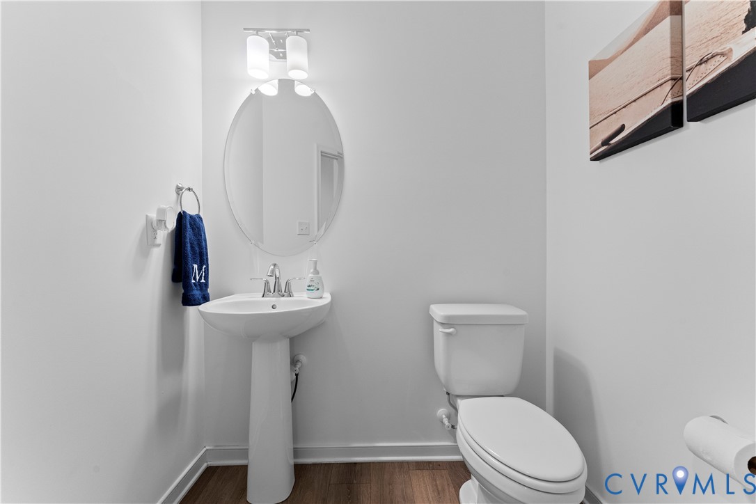 8819 Roberta Road Mechanicsville, VA 23116 - Photo 21 of 79 Pedestal sink with chrome faucet, oval mirror, and