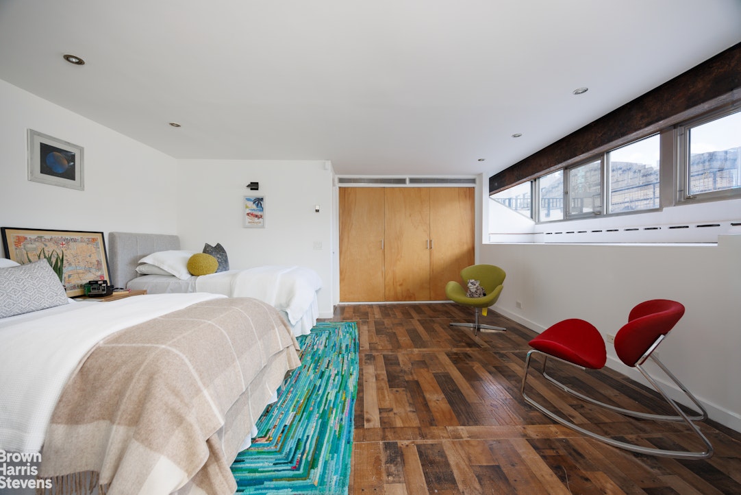 40 West 17th Street, Unit 12A Manhattan, NY 10011 - Photo 11 of 22 a bedroom with a bed and window