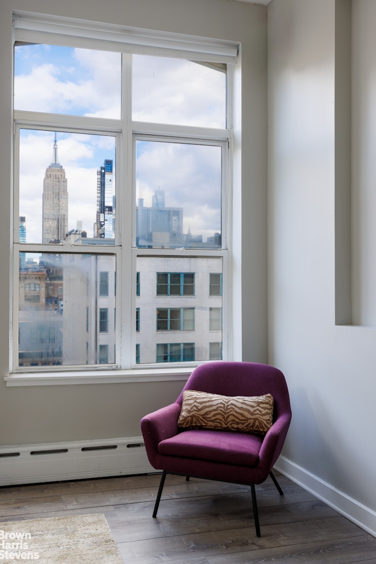 40 West 17th Street, Unit 12A Manhattan, NY 10011 - Photo 13 of 22 a bedroom with a bed and a window