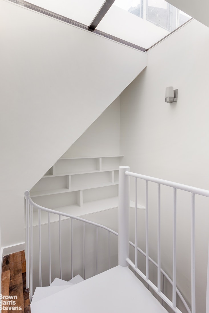 40 West 17th Street, Unit 12A Manhattan, NY 10011 - Photo 14 of 22 a bathroom with a sink and mirror