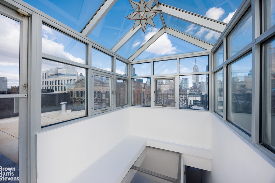 40 West 17th Street, Unit 12A Manhattan, NY 10011 - Photo 15 of 22 a large window with a glass door