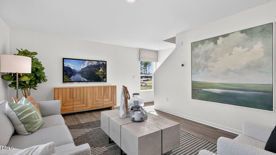 113 Ross Drive Stem, NC 27581 - Photo 20 of 42 a living room with furniture and a flat screen tv