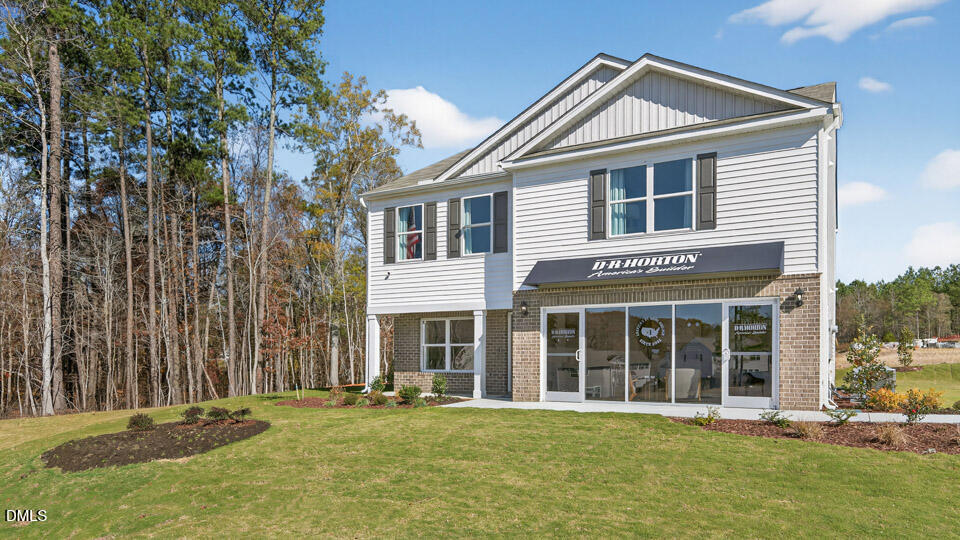 113 Ross Drive Stem, NC 27581 - Photo 2 of 42 a front view of a house with a yard