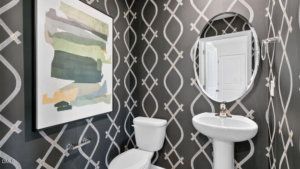 113 Ross Drive Stem, NC 27581 - Photo 21 of 42 a bathroom with a sink mirror and toilet