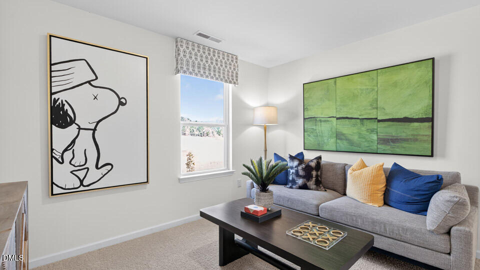 113 Ross Drive Stem, NC 27581 - Photo 23 of 42 a living room with furniture and a window