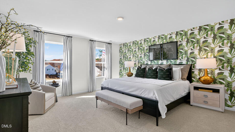 113 Ross Drive Stem, NC 27581 - Photo 25 of 42 a bedroom with a bed table flowerpot and window