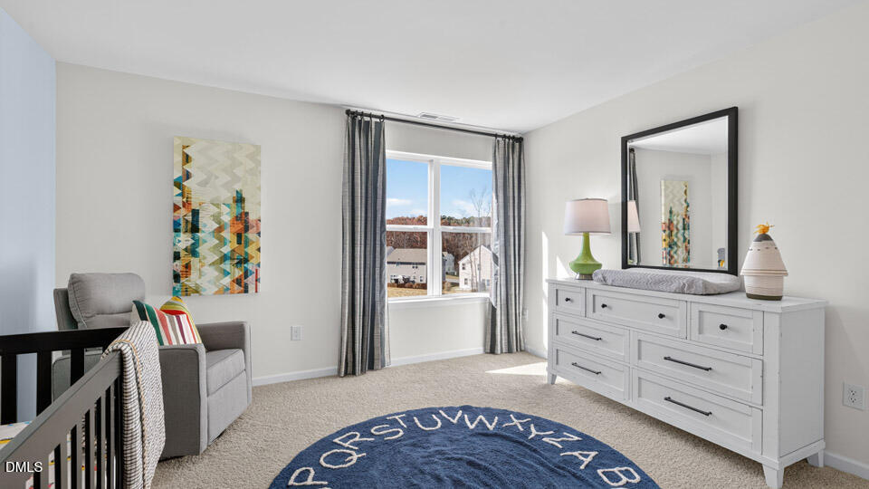 113 Ross Drive Stem, NC 27581 - Photo 30 of 42 a view of a bedroom with furniture and staircase