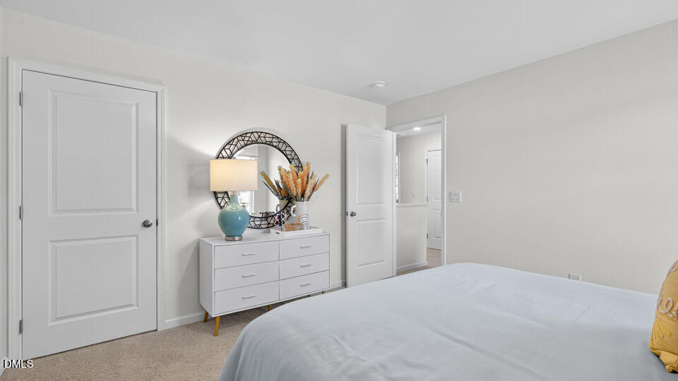 113 Ross Drive Stem, NC 27581 - Photo 35 of 42 a bedroom with a bed and a dresser