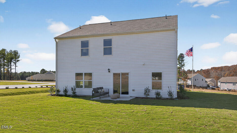 113 Ross Drive Stem, NC 27581 - Photo 42 of 42 a front view of house with yard and lake view
