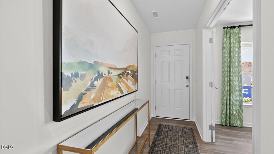 113 Ross Drive Stem, NC 27581 - Photo 6 of 42 a view of a hallway with wooden floor and closet