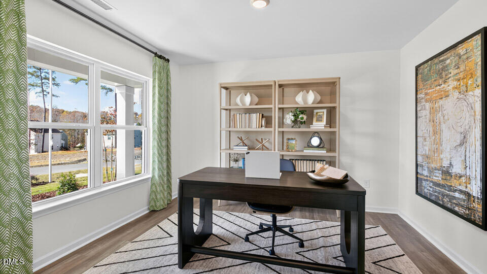 113 Ross Drive Stem, NC 27581 - Photo 7 of 42 a view of a workspace with furniture and a window