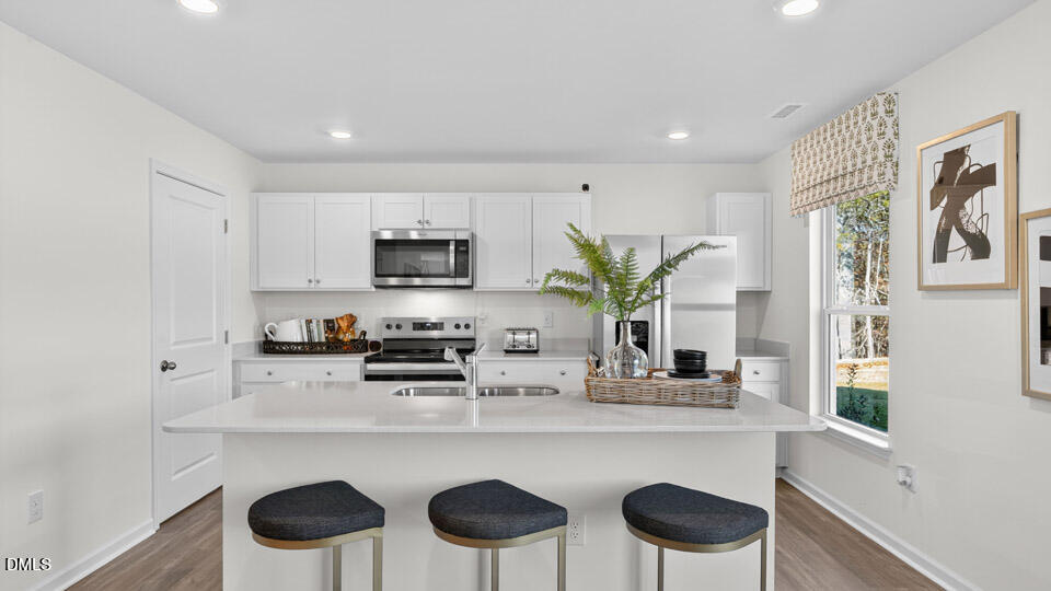 113 Ross Drive Stem, NC 27581 - Photo 10 of 42 a kitchen with a table and chairs in it
