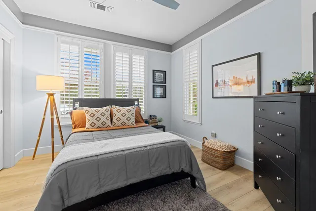 a bedroom with a bed and a dresser