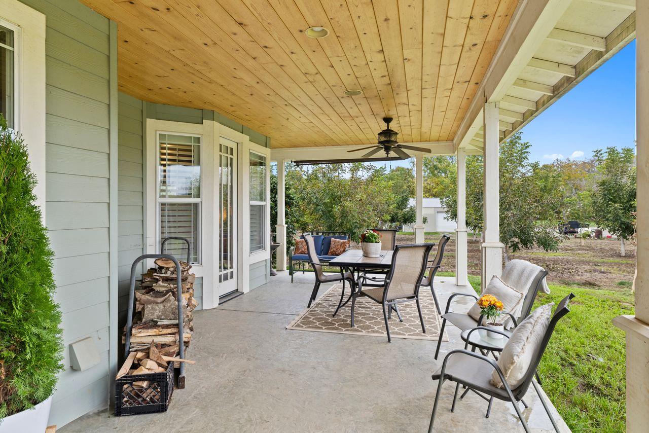 3302 Bear River Drive Rio Oso, CA 95674 - Photo 31 of 50 a view of a patio with table and chairs and potted plants
