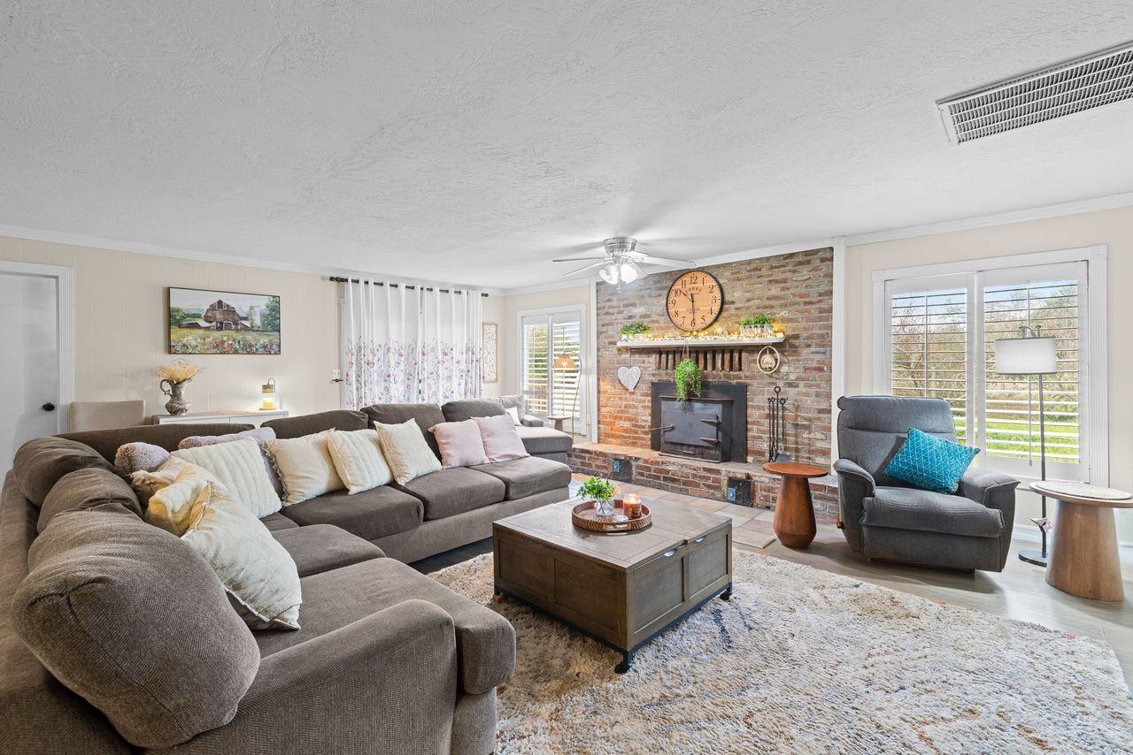 3302 Bear River Drive Rio Oso, CA 95674 - Photo 37 of 50 a living room with furniture fireplace and window