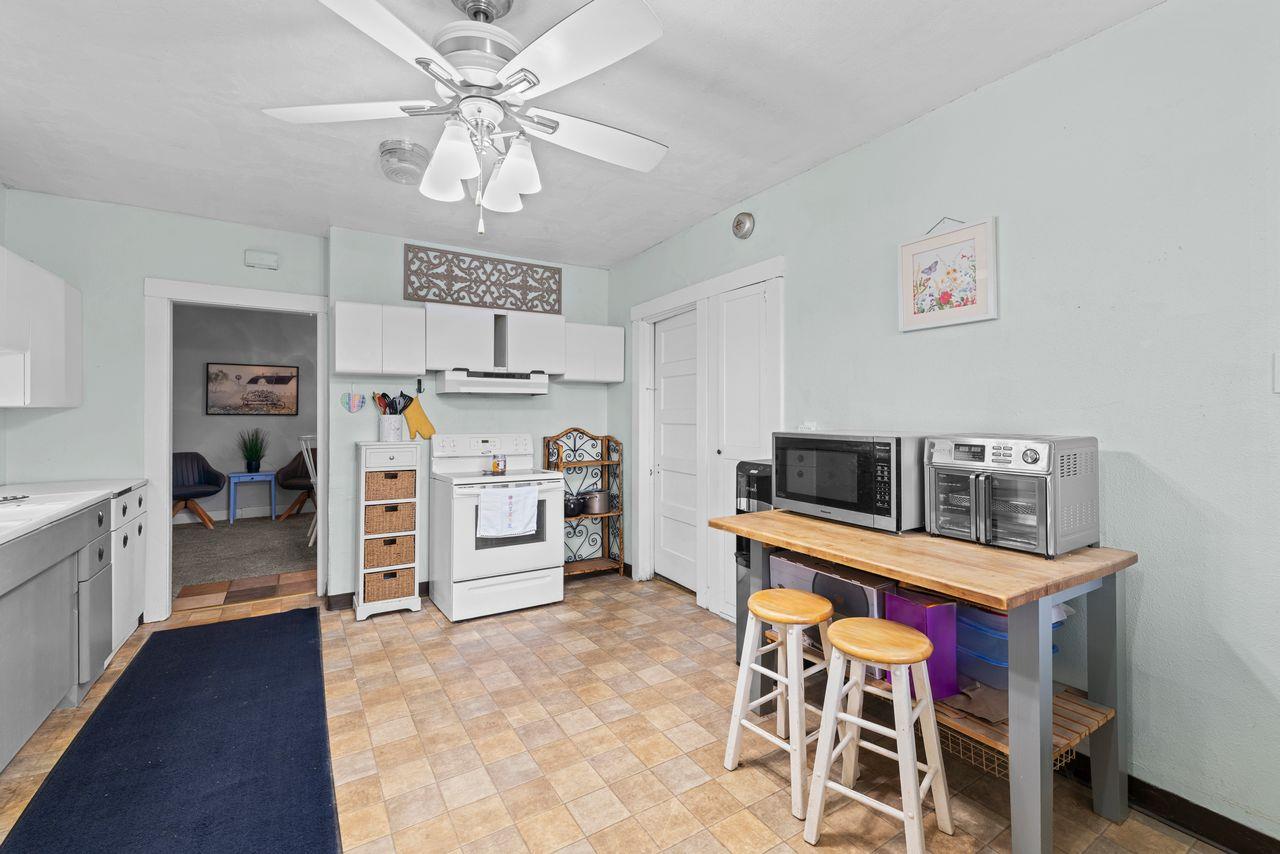 3302 Bear River Drive Rio Oso, CA 95674 - Photo 41 of 50 a kitchen that has a table chairs and cabinets