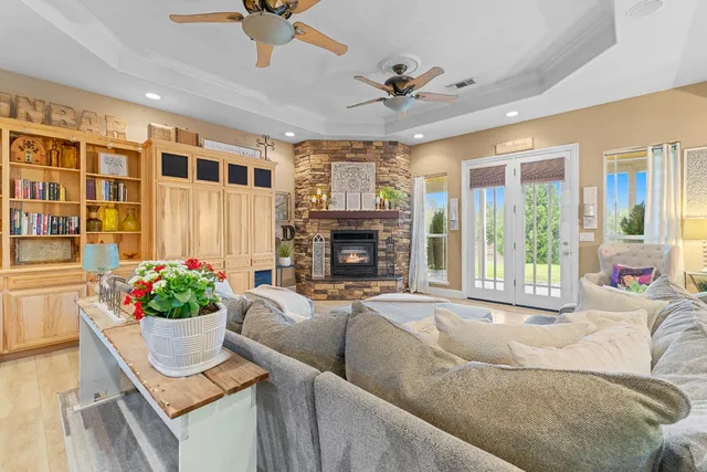a living room with furniture and a fireplace