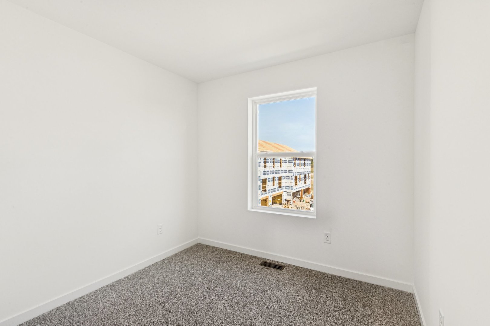 6530 Linden Trail, Unit C Wonder Lake, IL 60097 - Photo 18 of 27 an empty room with a window