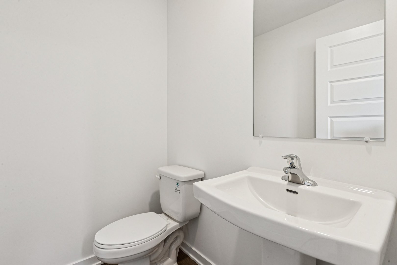 6530 Linden Trail, Unit C Wonder Lake, IL 60097 - Photo 5 of 27 a white toilet sitting next to a bathroom sink