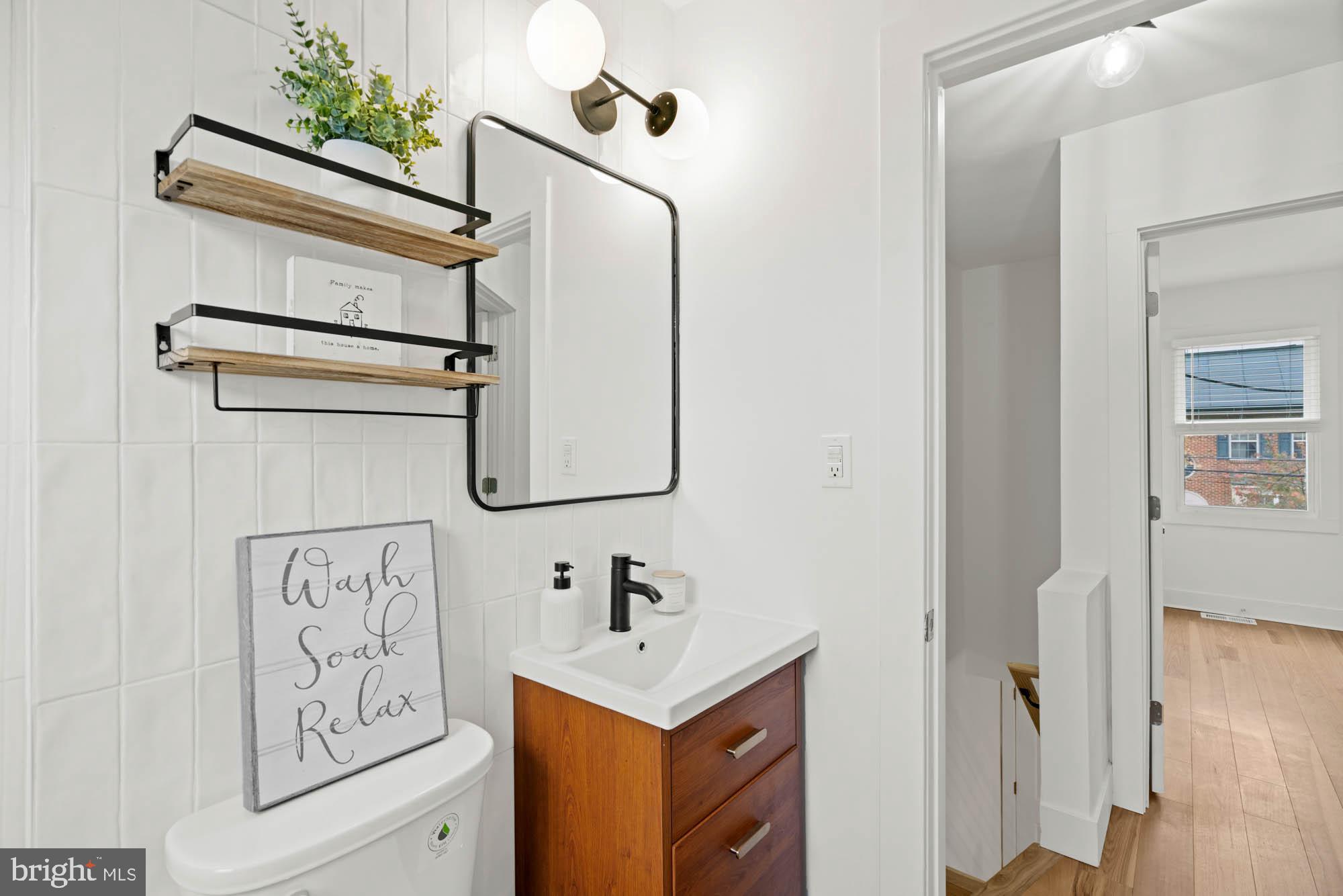 1458 Howard Road Southeast Washington, DC 20020 - Photo 31 of 49 a bathroom with a sink and a mirror
