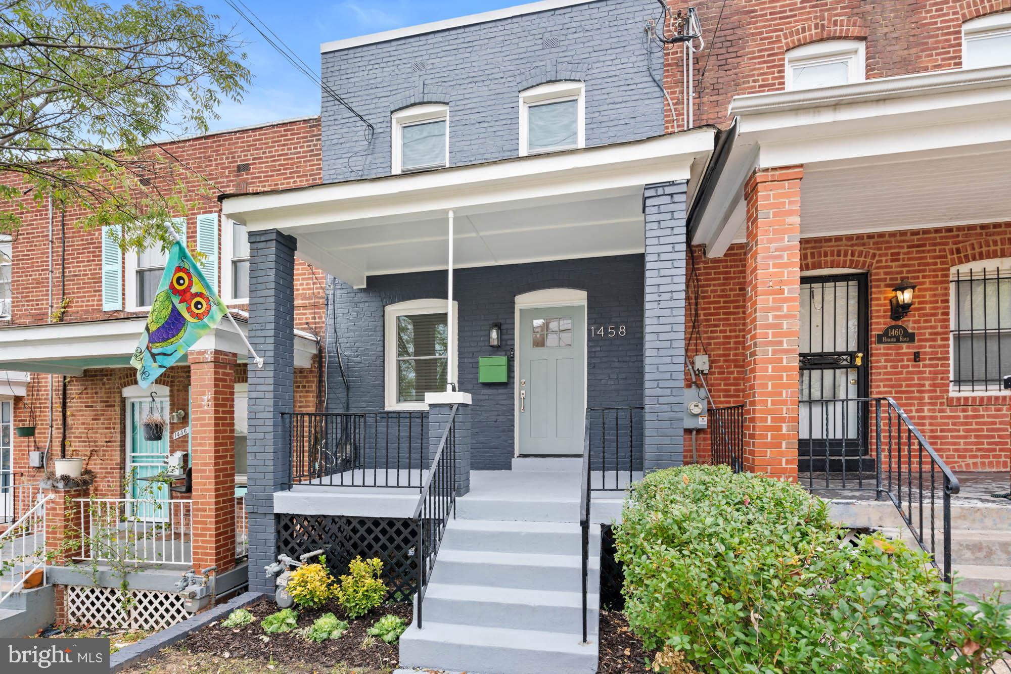 1458 Howard Road Southeast Washington, DC 20020 - Photo 5 of 49 a front view of a house with a garden