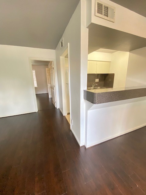 4701 Bell Street, Unit 10 Houston, TX 77023 - Photo 6 of 19 a view of a hallway with wooden floor