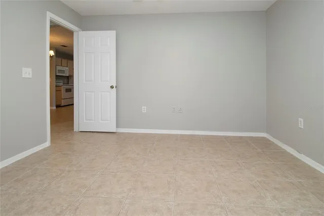 an empty room with closet area