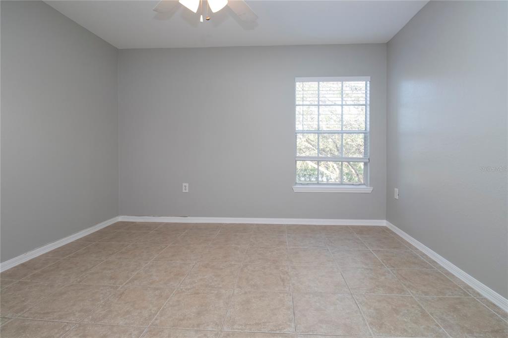8932 Manor Loop, Unit 104 Lakewood Ranch, FL 34202 - Photo 12 of 35 an empty room with a window