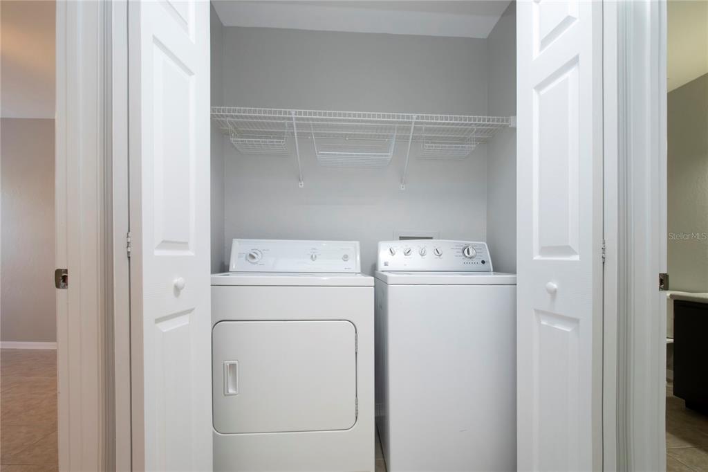 8932 Manor Loop, Unit 104 Lakewood Ranch, FL 34202 - Photo 14 of 35 a utility room with dryer and washer