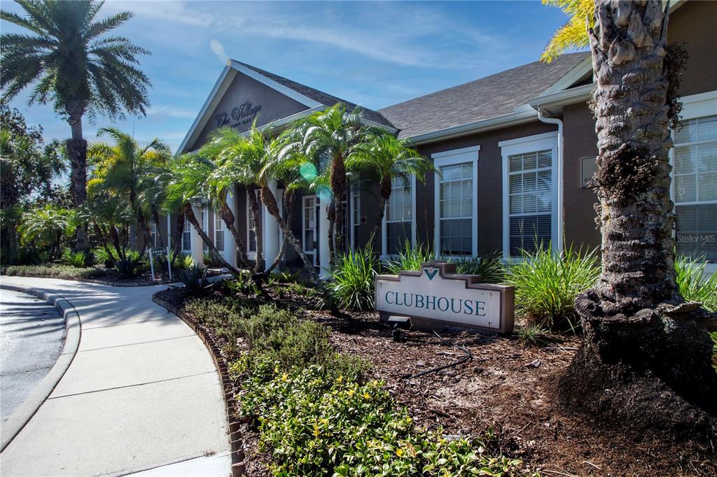 8932 Manor Loop, Unit 104 Lakewood Ranch, FL 34202 - Photo 23 of 35 a front view of house with yard and green space