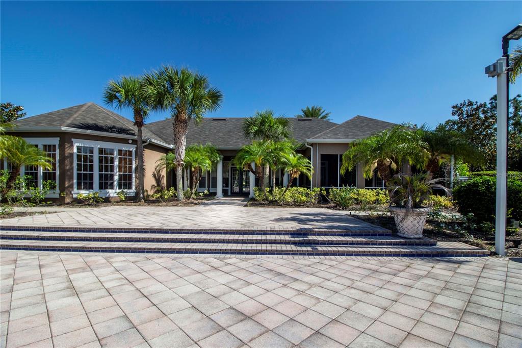 8932 Manor Loop, Unit 104 Lakewood Ranch, FL 34202 - Photo 27 of 35 a front view of a house with a porch