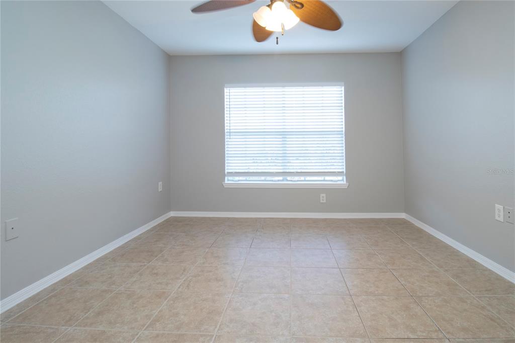 8932 Manor Loop, Unit 104 Lakewood Ranch, FL 34202 - Photo 4 of 35 an empty room with a window
