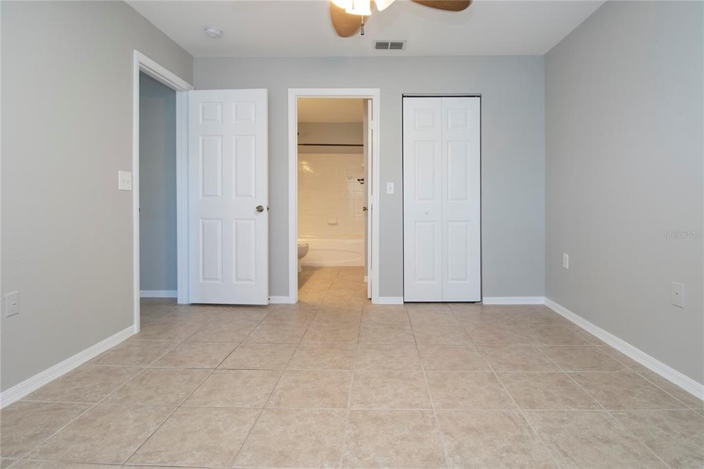 8932 Manor Loop, Unit 104 Lakewood Ranch, FL 34202 - Photo 5 of 35 an empty room with closet and windows