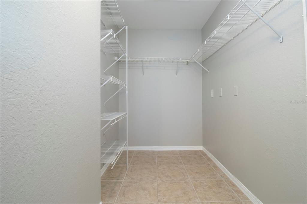 8932 Manor Loop, Unit 104 Lakewood Ranch, FL 34202 - Photo 7 of 35 a view of an empty walk in closet