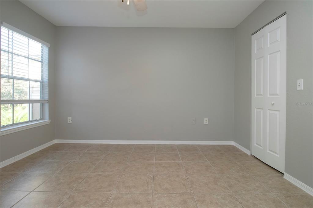 8932 Manor Loop, Unit 104 Lakewood Ranch, FL 34202 - Photo 9 of 35 an empty room with a window