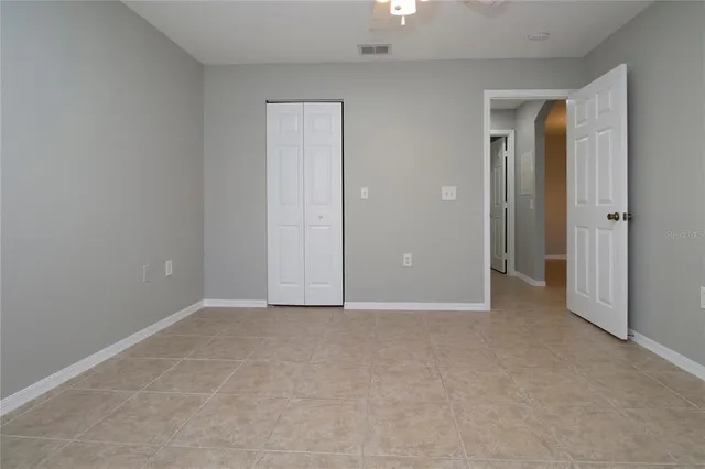an empty room with closet area