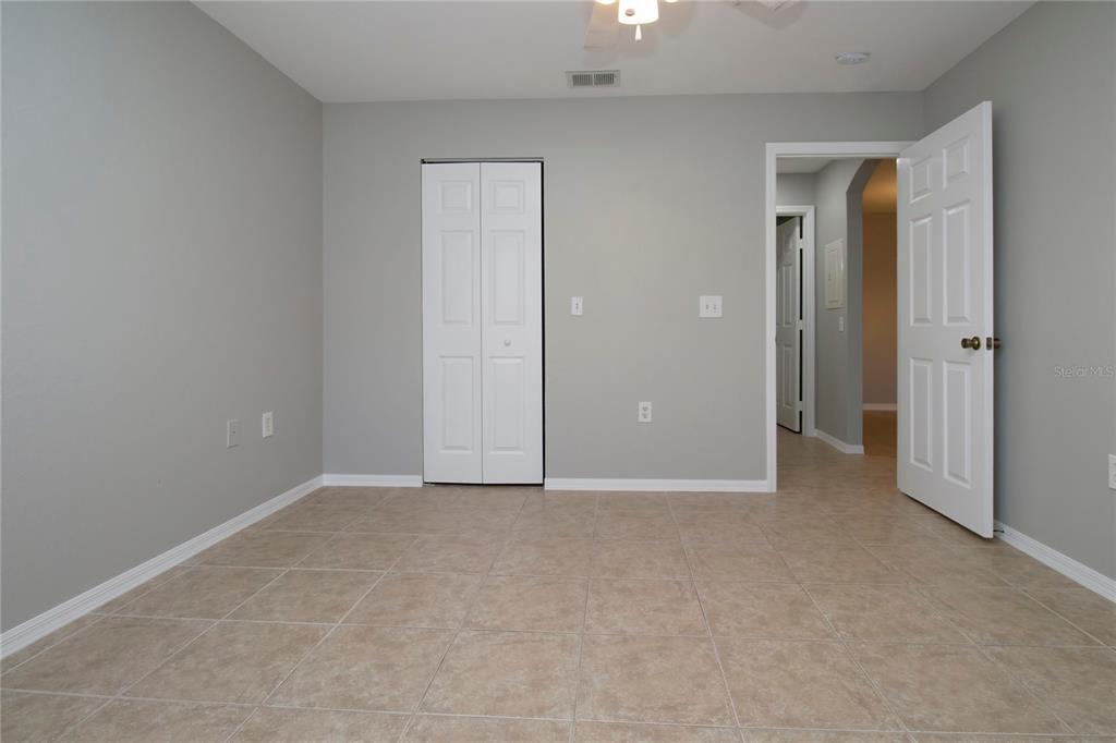8932 Manor Loop, Unit 104 Lakewood Ranch, FL 34202 - Photo 10 of 35 an empty room with closet area