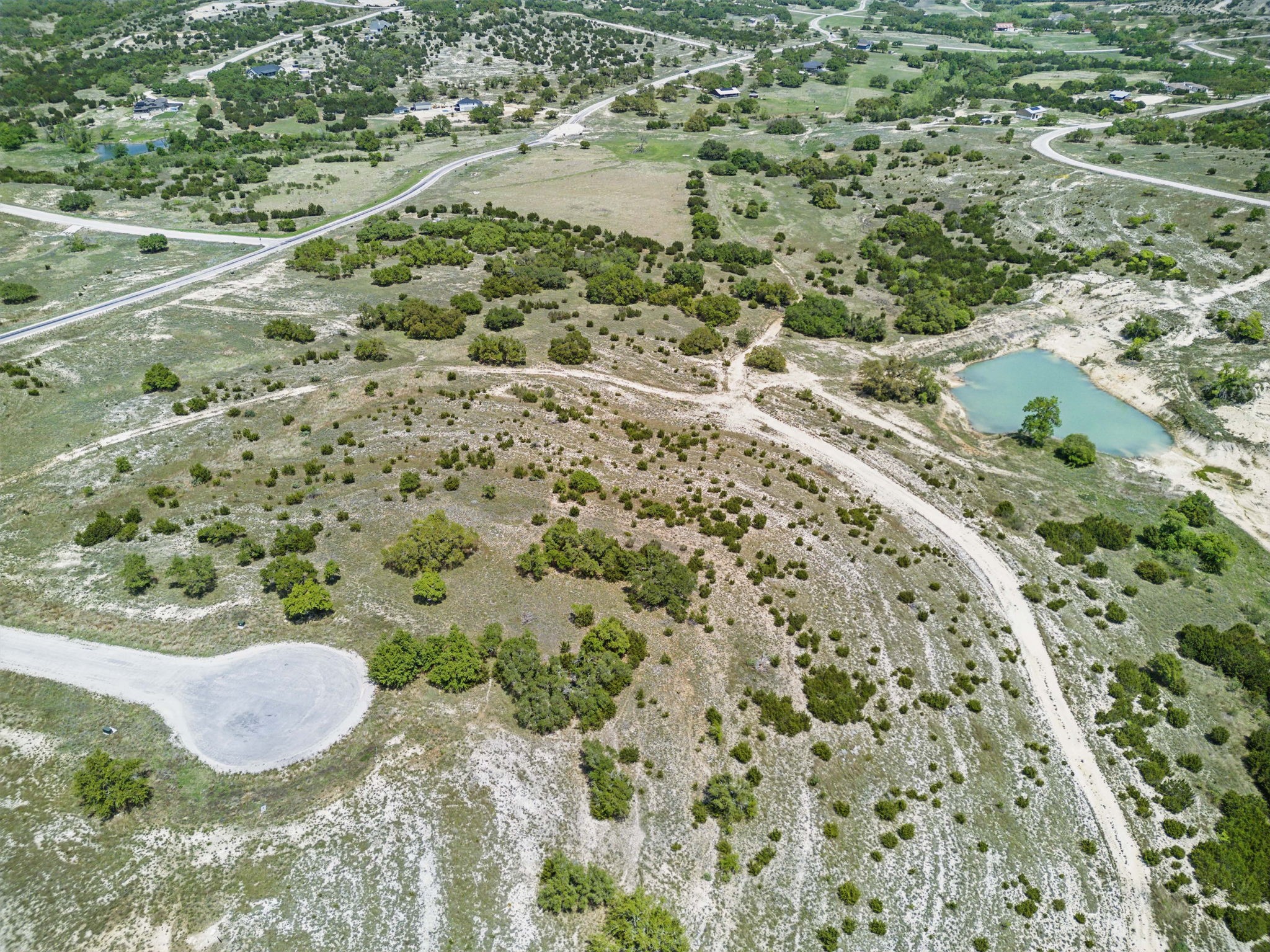 Lot 110 Star Point Blanco, TX 78606 - Photo 1 of 29 Aerial view of the property in Majestic Hills Ranch. Cul-de-sac for future home is conveniently located at the uppermost section of the lot. This allows for a 20+ mile views of the rolling Texas hill country.