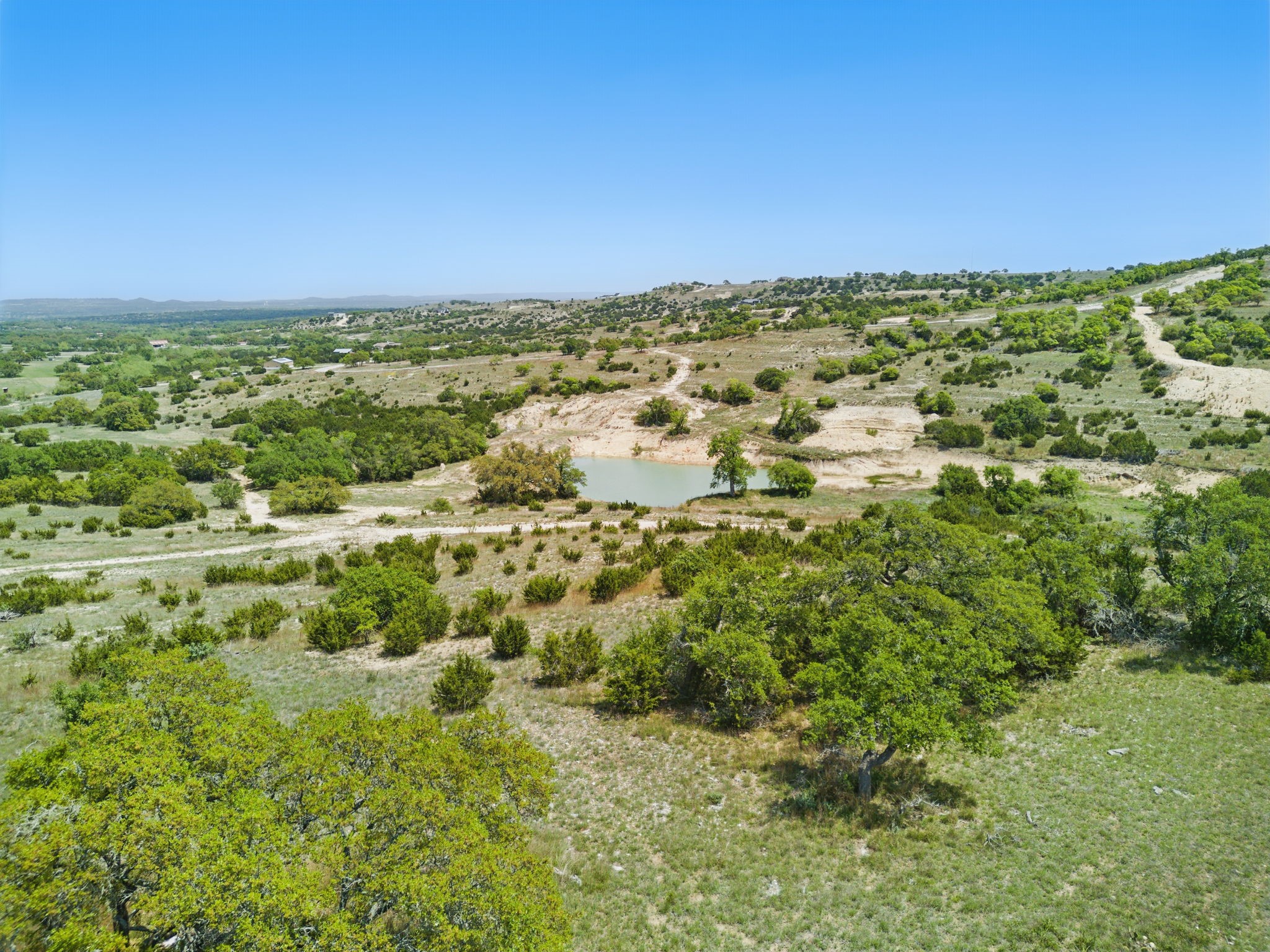 Lot 110 Star Point Blanco, TX 78606 - Photo 13 of 29 Gorgeous view of the nearby pond and Texas hill country.