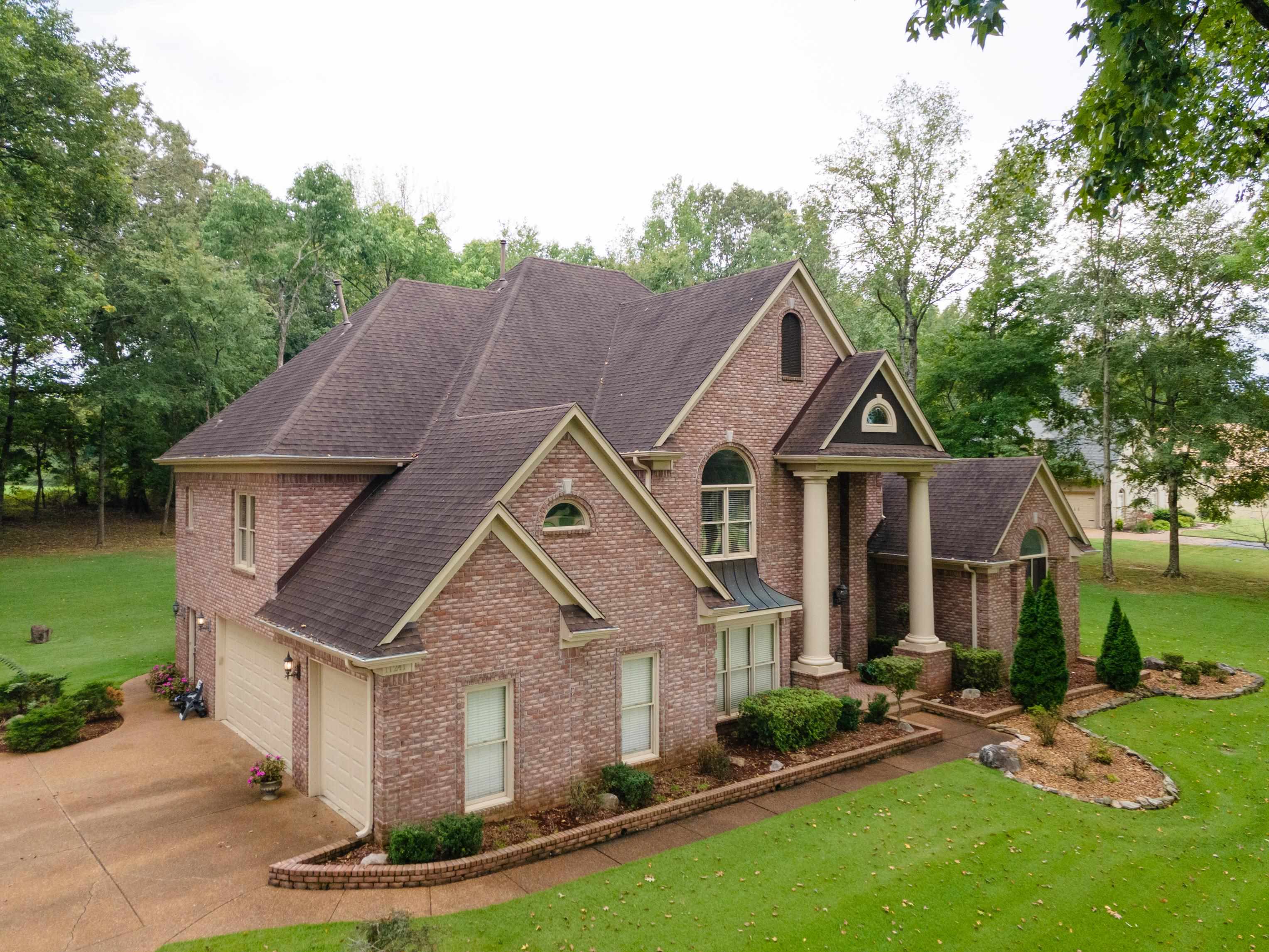 11241 Latting Road Eads, TN 38028 - Photo 2 of 31 View of front of house featuring a front yard and a garage
