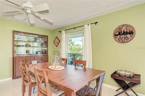 a kitchen with stainless steel appliances granite countertop a microwave a stove and white cabinets