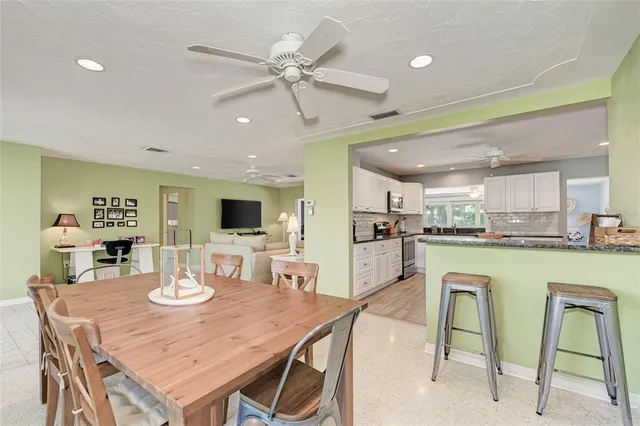 a kitchen with furniture and a wooden floors