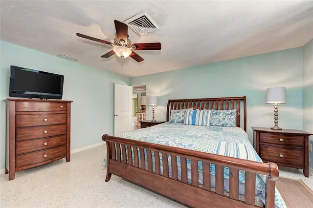 a bathroom with a sink a large mirror and vanity