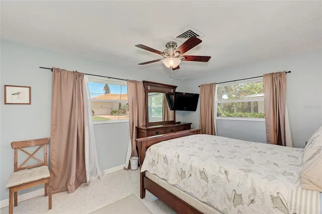a bedroom with a bed and large cabinets