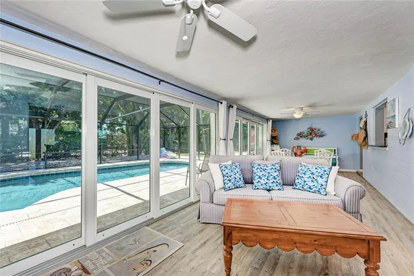 a backyard of a house with barbeque oven and outdoor seating