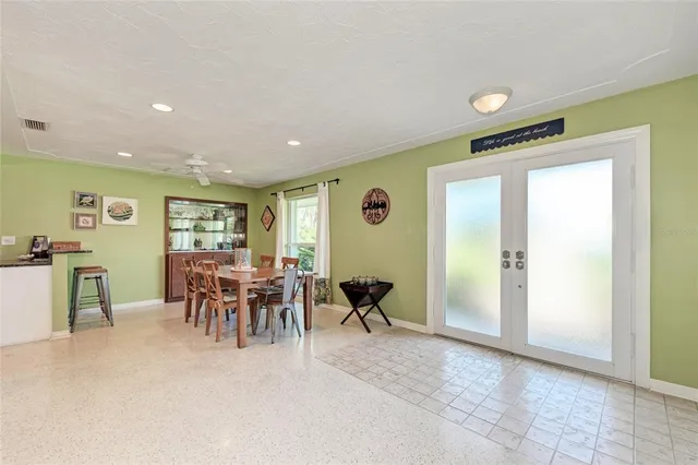 a view of a dining area with furniture window and wooden floor