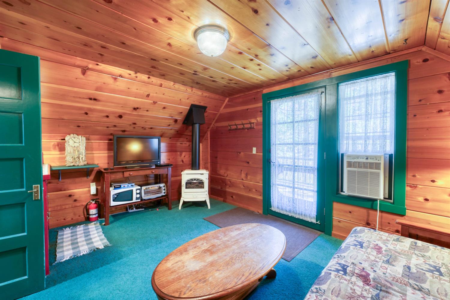 42025 Tollhouse Road Shaver Lake, CA 93664 - Photo 44 of 64 a living room with furniture and a flat screen tv